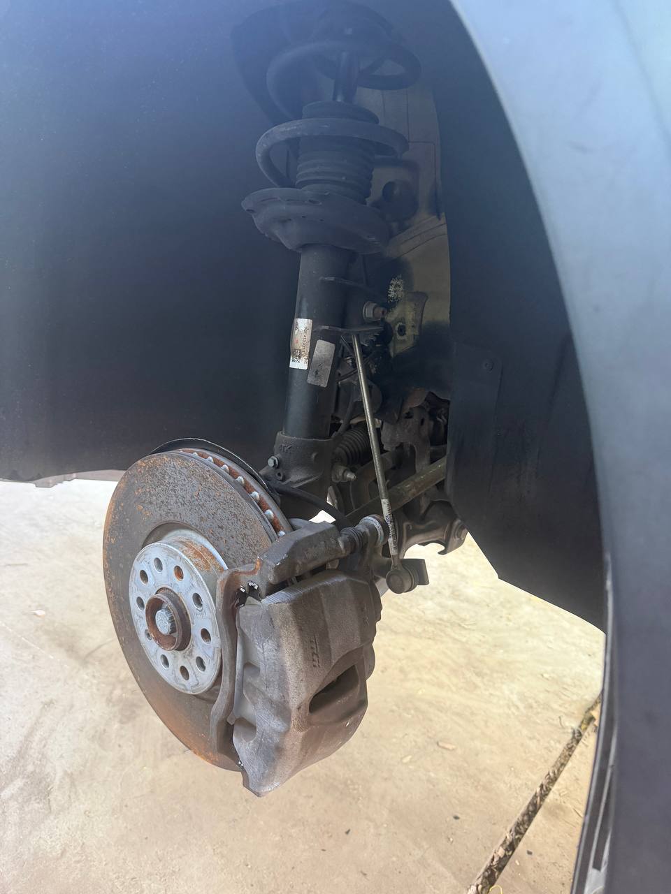 RoadPro mobile brake service — rotor and caliper on a customer vehicle